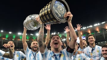 TOPSHOT - Argentina's Lionel Messi holds the trophy as he celebrates with teammates after winning the Conmebol 2021 Copa America football tournament final match against Brazil at Maracana Stadium in Rio de Janeiro, Brazil, on July 10, 2021. - Argenti