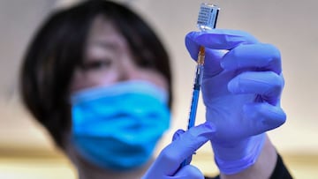 A medical worker fills a syringe with a dose of the Pfizer-BioNTech Covid-19 vaccine as the country launches its inoculation campaign at the Chiba Rosai Hospital in Ichihara, Chiba perfecture on February 17, 2021. (Photo by Kazuhiro NOGI / AFP)