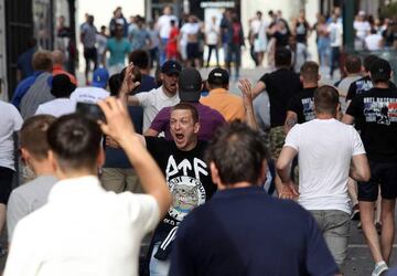 A supporter shouts during street brawls ahead of Saturday's Euro 2016 match between England and Russia.