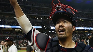 FILE - In this Oct. 7, 2018, file photo, Atlanta Braves catcher Kurt Suzuki celebrates after Game 3 of baseball's National League Division Series against the Los Angeles Dodgers, in Atlanta. Catcher Kurt Suzuki is heading back to the Washington Nationals after agreeing to a $10 million, two-year contract, a deal pending a successful physical. The deal was disclosed to The Associated Press on Monday, Nov. 19, 2018, by a person familiar with the agreement who spoke on condition of anonymity because the contract was not yet official. (AP Photo/John Amis, File)