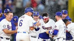 ARLINGTON, TEXAS - MARCH 28: Jonah Heim #28 of the Texas Rangers is congratulated by teammates following a walk off single to defeat the Chicago Cubs in the Opening Day game at Globe Life Field on March 28, 2024 in Arlington, Texas.   Stacy Revere/Getty Images/AFP (Photo by Stacy Revere / GETTY IMAGES NORTH AMERICA / Getty Images via AFP)