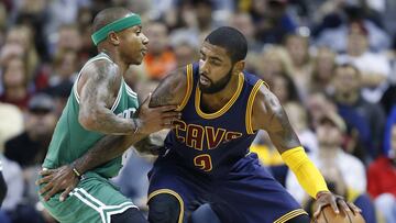 FILE - In this Nov. 3, 2016, file photo, Cleveland Cavaliers' Kyrie Irving, right, looks to drive against Boston Celtics' Isaiah Thomas during the first half of an NBA basketball game in Cleveland. Irving, who asked Cavaliers owner Dan Gilbert to trade him earlier this summer, could be on his way to Boston as the Cavaliers are in serious negotiations with the Celtics about swapping him for point guard Thomas. Since Irving made his stunning request, the defending Eastern Conference champions have been looking for a trade partner. They may have found the perfect one and could be nearing a deal with the Celtics, said the person who spoke Tuesday night, Aug. 22, 2017, to The Associated Press on condition of anonymity because of the sensitivity of the talks. (AP Photo/Ron Schwane, File)