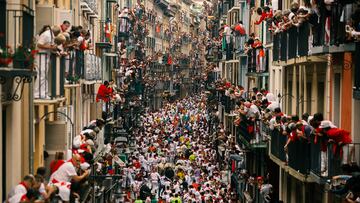 PAMPLONA, SPAIN - JULY 07: Revellers run with Puerto de San Lorenzo's fighting bulls during the second day of the San Fermin Running of the Bulls festival on July 7, 2018 in Pamplona, Spain. The annual Fiesta de San Fermin, made famous by the 1926 novel of US writer Ernest Hemmingway entitled 'The Sun Also Rises', involves the daily running of the bulls through the historic heart of Pamplona to the bull ring. (Photo by Pablo Blazquez Dominguez/Getty Images)