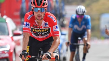 Overall leader Team Jumbo&#039;s Slovenian rider Primoz Roglic pants as he crosses the finish line in second place during the 9th stage of the 2021 La Vuelta cycling tour of Spain, a 188 km race from Puerto Lumbreras to Alto de Velefique, on August 22, 2021. - Bahrain Victorious rider Damiano Caruso won today&#039;s mountainous stage 9 of the Vuelta a Espana as Primoz Roglic strengthened his grip on the overall lead coming third behind Movistar&#039;s Enric Mas. (Photo by Jose Jordan / AFP)