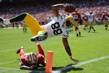 Jermichael Finley (88) de los Green Bay Packers ante Donte Whitner (31) de San Francisco 49ers.