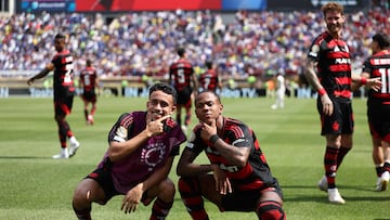 Flamengo's Brazilian midfielder #64 Wallace Jan (R) celebrates with teammate Brazilian forward #20 Matheus Goncalves after scoring his team's third goal during the FIFA Club World Cup 2025 Group D football match between Brazil's CR Flamengo and England's Chelsea at the Lincoln Financial Field stadium in Philadelphia on June 20, 2025. (Photo by FRANCK FIFE / AFP)