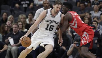 San Antonio Spurs center Pau Gasol (16) drives around Houston Rockets center Clint Capela (15) during the first half of an NBA basketball game, Wednesday, Nov. 9, 2016, in San Antonio. (AP Photo/Eric Gay)