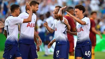 Tottenham players celebrate with goalscorer Lucas Moura (C) after he scored an equalizer against AS Roma during their International Champions Cup match in San Diego, California on July 25, 2018, where Tottenham defeated Roma 4-1. / AFP PHOTO / Frederic J.
