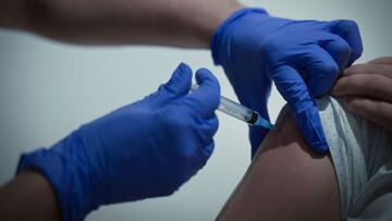 A healthcare worker administers a dose of Russia's Sputnik V Covid-19 vaccine to a patient at a vaccination centre in the GUM, State Department store in Moscow on July 2, 2021. - Russia on July 2, 2021, reported 679 coronavirus deaths, a record number of pandemic-related fatalities over a 24-four period for the fourth day in a row, a government tally showed. Russia, the fifth worst-hit country in the world, is battling a surging outbreak driven by the highly infectious Delta variant and worsened by a lagging vaccination drive. (Photo by Natalia KOLESNIKOVA / AFP)