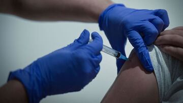 A healthcare worker administers a dose of Russia&#039;s Sputnik V Covid-19 vaccine to a patient at a vaccination centre in the GUM, State Department store in Moscow on July 2, 2021. - Russia on July 2, 2021, reported 679 coronavirus deaths, a record numbe