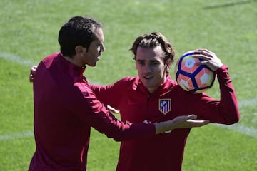 Atletico Madrid's Uruguayan defender Diego Godin wants to take a ball to Atletico Madrid's French forward Antoine Griezmann