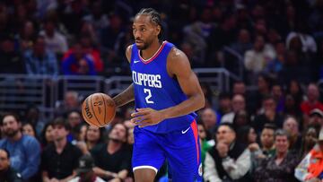 Nov 27, 2023; Los Angeles, California, USA; Los Angeles Clippers forward Kawhi Leonard (2) moves the ball up court against the Denver Nuggets during the first half at Crypto.com Arena. Mandatory Credit: Gary A. Vasquez-USA TODAY Sports