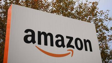 (FILES) In this file photo taken on November 27, 2019 An Amazon sign is pictured at the Amazon Fulfilment Centre in Peterborough, east England on November 27, 2019, as preparations are underway for the annual Black Friday Sale. - Amazon will create 7,000 