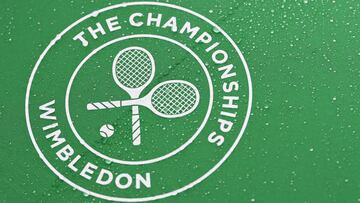 LONDON, ENGLAND - JUNE 28: A detailed view of rain droplets seen on a Wimbledon Championships logo during Day One of The Championships - Wimbledon 2021 at All England Lawn Tennis and Croquet Club on June 28, 2021 in London, England. (Photo by Mike Hewitt/