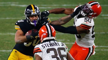 PITTSBURGH, PENNSYLVANIA - JANUARY 10: James Conner #30 of the Pittsburgh Steelers is pursued by Jacob Phillips #50 of the Cleveland Browns during the second half of the AFC Wild Card Playoff game at Heinz Field on January 10, 2021 in Pittsburgh, Pennsylv