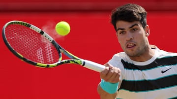 Spain's Carlos Alcaraz returns against Australia's Adam Walton during their men's singles round of 32 tennis match at the HSBC ATP tennis Championships at Queen's Club in west London on June 17, 2025. (Photo by Adrian Dennis / AFP)
