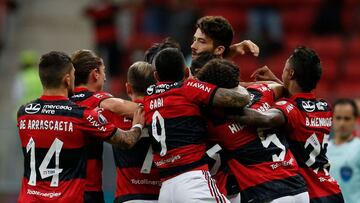 Brazil&#039;s Flamengo Rodrigo Caio (covered) celebrates with teammates after scoring against Argentina&#039;s Defensa y Justicia during the Copa Libertadores Copa Libertadores round of 16 second leg football match at the Mane Garrincha Stadium in Brasili