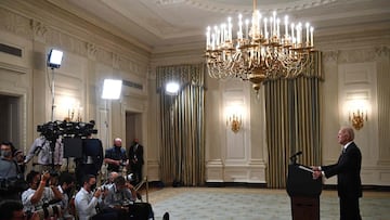 US President Joe Biden delivers remarks on plans to stop the spread of the Delta variant and boost Covid-19 vaccinations at the State Dinning Room of the White House, in Washington, DC on September 9, 2021. 