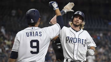 SAN DIEGO, CA - AUGUST 28: Travis Jankowski #16 of the San Diego Padres is congratulated by Luis Urias #9 after hitting a solo home run during the first inning of a baseball game against the Seattle Mariners at PETCO Park on August 28, 2018 in San Diego, California.   Denis Poroy/Getty Images/AFP
 == FOR NEWSPAPERS, INTERNET, TELCOS &amp; TELEVISION USE ONLY ==