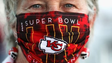 A Kansas City Chiefs fan wears a themed face mask during the ongoing coronavirus disease (COVID-19) outbreak and earrings ahead of the weekend's Super Bowl LV between the Kansas City Chiefs and Tampa Bay Buccaneers in Tampa, Florida, U.S., February 5