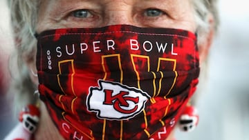 A Kansas City Chiefs fan wears a themed face mask during the ongoing coronavirus disease (COVID-19) outbreak and earrings ahead of the weekend&#039;s Super Bowl LV between the Kansas City Chiefs and Tampa Bay Buccaneers in Tampa, Florida, U.S., February 5