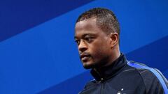 France&#039;s defender Patrice Evra arrives for a press conference in Clairefontaine en Yvelines on June 30, 2016, during the Euro 2016 football tournament.   / AFP PHOTO / FRANCK FIFE