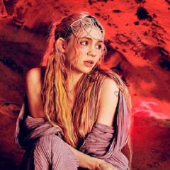 Grimes, pareja de Elon Musk, cubre su espalda con "cicatrices alienígenas"