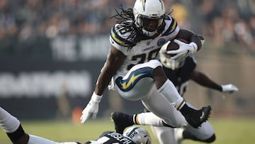 OAKLAND, CA - NOVEMBER 11: Melvin Gordon #28 of the Los Angeles Chargers jumps over Karl Joseph #42 of the Oakland Raiders during their NFL game at Oakland-Alameda County Coliseum on November 11, 2018 in Oakland, California.   Ezra Shaw/Getty Images/AFP
 == FOR NEWSPAPERS, INTERNET, TELCOS &amp; TELEVISION USE ONLY ==