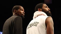 (FILES) In this file photo taken on January 18, 2020 Kevin Durant #7 and Kyrie Irving #11 of the Brooklyn Nets look on during their game against the Milwaukee Bucks at Barclays Center in New York City. NOTE TO USER: User expressly acknowledges and agrees that, by downloading and/or using this photograph, user is consenting to the terms and conditions of the Getty Images License Agreement. - Kevin Durant is reportedly among four Brooklyn Nets players who have tested positive for the new coronavirus and are in isolation.
 The injured Durant, who has yet to play for the Nets since signing for the club last year, confirmed to The Athletic website he had tested positive for the virus. (Photo by AL BELLO / GETTY IMAGES NORTH AMERICA / AFP)