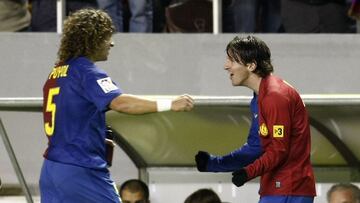 Puyol y Messi. 