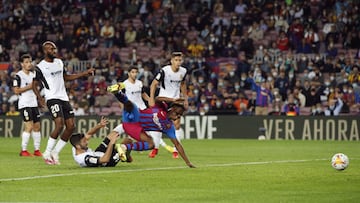 Soccer Football - LaLiga - FC Barcelona v Valencia - Camp Nou, Barcelona, Spain - October 17, 2021 Valencia's Jose Gaya fouls FC Barcelona's Ansu Fati to concede a penalty REUTERS/Albert Gea