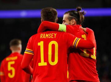 Bale celebrates with Aaron Ramsey after the Juventus midfielder scored his and Wales' second goal against Hungary.