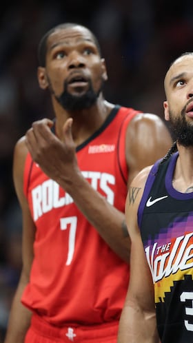 PHOENIX, ARIZONA - APRIL 07: Dillon Brooks #3 of the Phoenix Suns and Kevin Durant #7 of the Houston Rockets react during the first half of the NBA game at Mortgage Matchup Center on April 07, 2026 in Phoenix, Arizona. NOTE TO USER: User expressly acknowledges and agrees that, by downloading and or using this photograph, user is consenting to the terms and conditions of the Getty Images License Agreement. Christian Petersen/Getty Images/AFP (Photo by Christian Petersen / GETTY IMAGES NORTH AMERICA / Getty Images via AFP)