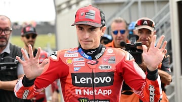 Ducati Lenovo Team's Spanish MotoGP rider Marc Marquez greets fans at the paddock before the warm-up session of the MotoGP Japanese Grand Prix at the Mobility Resort Motegi in Motegi, Tochigi prefecture on September 28, 2025. (Photo by Toshifumi KITAMURA / AFP)