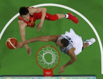 Rudy Gobert (FRA) of France blocks a shot by Zhou Peng (CHN) of China. 