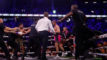 Boxing - Logan Paul v Dillon Danis - AO Arena, Manchester, Britain - October 14, 2023 Dillon Danis clashes with Logan Paul as security comes onto the ring Action Images via Reuters/Jason Cairnduff