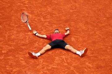 Novak allowed a little lie down after his first French title.