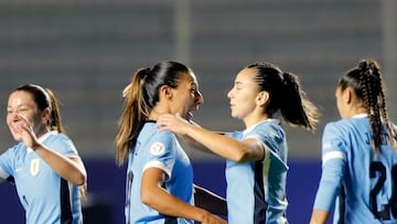 Uruguay's midfielder #09 Pamela Gonzalez (2-L) celebrates with her teammates after scoring her team's first goal from a penalty kick during the Women's Copa America 2025 football match between Chile and Uruguay at the Gonzalo Pozo Ripalda stadium in Quito on July 24, 2025. (Photo by ARMANDO PRADO / AFP)
