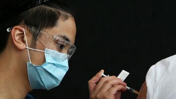 SYDNEY, AUSTRALIA - AUGUST 08: Registered Nurse Aldrick administers a COVID-19 vaccine to a client at the Lebanese Muslim Association (LMA) in Lakemba on August 08, 2021 in Sydney, Australia. The Sydney Local Health District have partnered with the Lebane