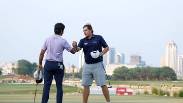 Spain's Jorge Campillo (L) congratulates Finland's Sami Valimaki after winning their face-off on day four of the European Tour's Qatar Masters, at the Doha Golf Club, in Doha on October 29, 2023. (Photo by KARIM JAAFAR / AFP)