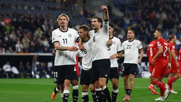 Soccer Football - FIFA World Cup - UEFA Qualifiers - Group A - Germany v Luxembourg - Rhein-Neckar-Arena, Sinsheim, Germany - October 10, 2025 Germany's Joshua Kimmich celebrates scoring their second goal with Nick Woltemade and Leon Goretzka REUTERS/Kai Pfaffenbach
