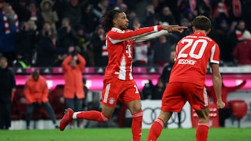 Bayern Munich's French midfielder #17 Michael Olise (L) celebrates scoring his team's sixth goal with Bayern Munich's German midfielder #20 Tom Bischof during the German first division Bundesliga football match between FC Bayern Munich and SC Freiburg in Munich, southern Germany on November 22, 2025. Bayern Munich won the match 6-2. (Photo by Karl-Josef HILDENBRAND / AFP) / DFL REGULATIONS PROHIBIT ANY USE OF PHOTOGRAPHS AS IMAGE SEQUENCES AND/OR QUASI-VIDEO