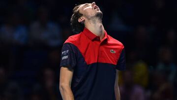 Russia's Danil Medvedev reacts against Germany's Alexander Zverev during their men's singles round-robin match on day six of the ATP World Tour Finals tennis tournament at the O2 Arena in London on November 15, 2019. (Photo by Glyn KIRK / A