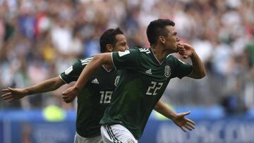 Mexico's forward Hirving Lozano (front C) celebrates after scoring a goal next to teammate midfielder Andres Guardado during the Russia 2018 World Cup Group F football match between Germany and Mexico at the Luzhniki Stadium in Moscow on June 17, 201