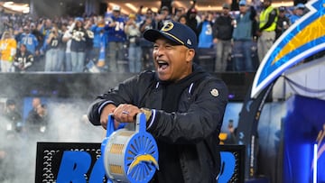 Nov 25, 2024; Inglewood, California, USA; Los Angeles Dodgers manager Dave Roberts serves as honorary Los Angeles Chargers team captain during the game against the Baltimore Ravens at SoFi Stadium. Mandatory Credit: Kirby Lee-Imagn Images