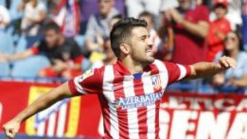 GOL. Villa celebra un gol con el Atlético y hoy quiere marcarle al Madrid, como lo hizo con el Valencia.