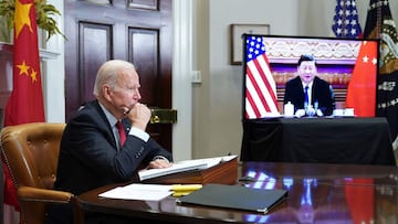 (FILES) In this file photo taken on November 15, 2021 US President Joe Biden meets with China's President Xi Jinping during a virtual summit from the Roosevelt Room of the White House in Washington, DC. - US President Joe Biden will warn his Chinese counterpart Xi Jinping on Friday that he will face "costs" if Beijing rescues fellow authoritarian ally Russia from intense Western sanctions aimed at punishing Moscow's invasion of Ukraine.
The two leaders' first phone call since a video summit in November will be a chance to air differences as the United States spearheads an unprecedented pressure campaign on Russia, placing China in a geopolitical bind. (Photo by MANDEL NGAN / AFP)