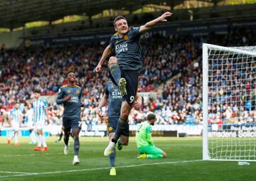 Leicester City's Jamie Vardy celebrates after scoring the team's fourth goal against Huddersfield .