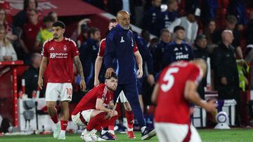 Nottingham Forest's Portuguese manager Nuno Espirito Santo (rear) comforts Nottingham Forest's Welsh defender #07 Neco Williams at the end of the English Premier League football match between Nottingham Forest and Brentford at The City Ground in Nottingham, central England, on May 1, 2025. Brentford wins 2 - 0 against Nottingham Forest. (Photo by Darren Staples / AFP) / RESTRICTED TO EDITORIAL USE. No use with unauthorized audio, video, data, fixture lists, club/league logos or 'live' services. Online in-match use limited to 120 images. An additional 40 images may be used in extra time. No video emulation. Social media in-match use limited to 120 images. An additional 40 images may be used in extra time. No use in betting publications, games or single club/league/player publications. /