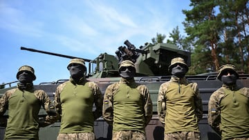 Ukrainian soldiers stand next to the Marder 1A3 (SPz), an armoured fighting vehicle, during a media day of the European Union Military Assistance Mission in support of Ukraine (EUMAM Ukraine) in Klietz, Germany August 17, 2023. REUTERS/Annegret Hilse